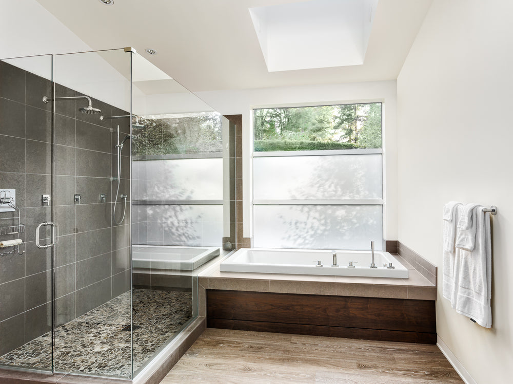 Large furnished bathroom in luxury home with hardwood floor and title
