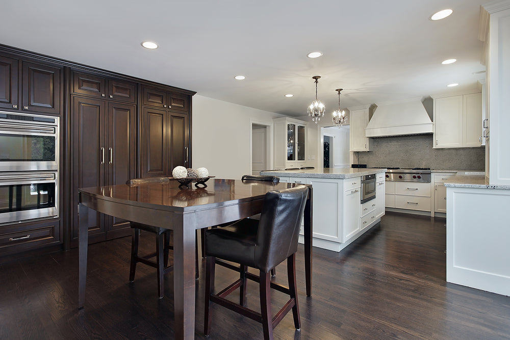 Kitchen in new construction home with dark wood cabinetry